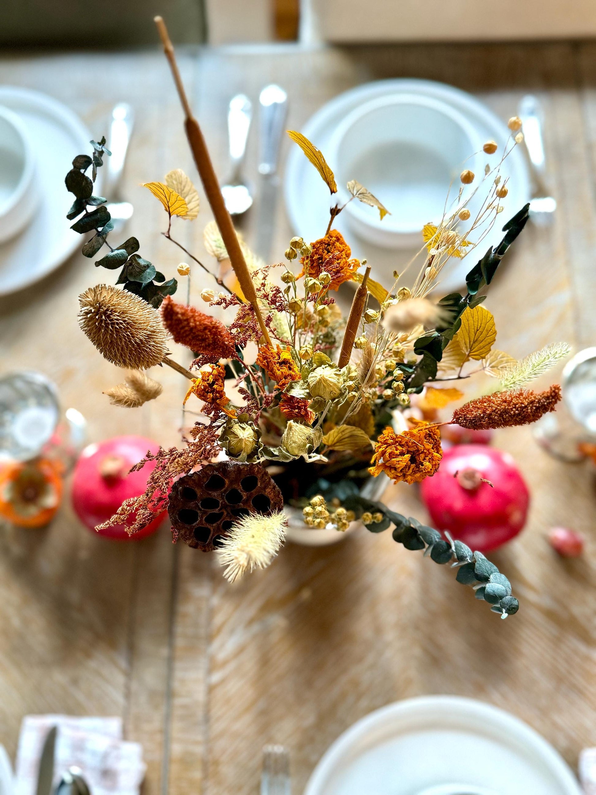 The Blissful bouquet is a stunning Fall inspired bouquet featuring preserved eucalyptus and magnolia, dried marigolds, millet, flax, pods and bunny tails. Stunning as a centerpiece for your Thanksgiving table or all year round for the Fall lovers.