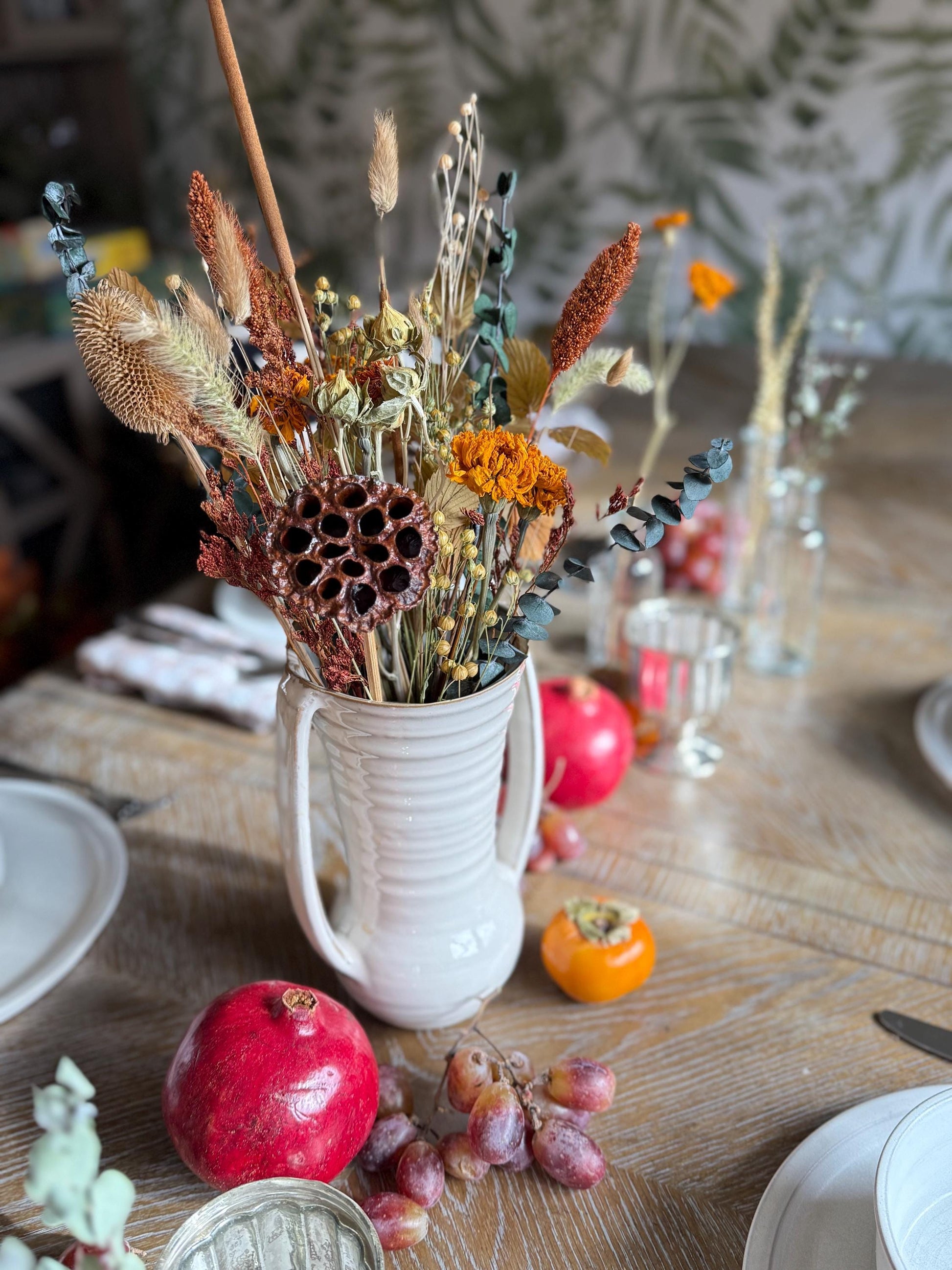 The Blissful bouquet is a stunning Fall inspired bouquet featuring preserved eucalyptus and magnolia, dried marigolds, millet, flax, pods and bunny tails. Stunning as a centerpiece for your Thanksgiving table or all year round for the Fall lovers.