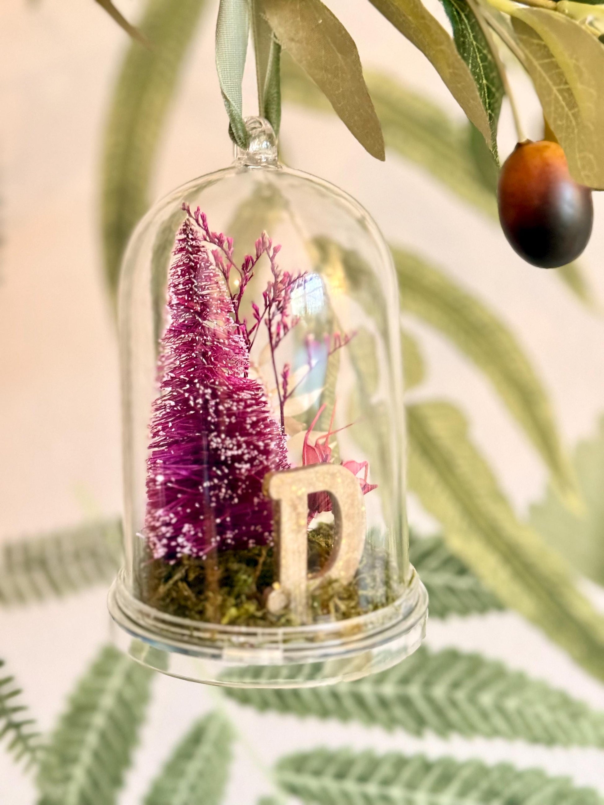 Personalized with initial Ornament - Preserved moss, caspia, nigella, bottlebrush tree and a sparkly gold wooden letter on a moss base; hung by a pine green color velvet ribbon.